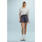Woman wearing casual athletic attire in Layla Linen Shorts with Side Slits, perfect for stylish womens clothes or moms on the go
