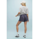 Woman in Layla Linen Shorts with Side Slits wearing stylish womens clothes perfect for moms