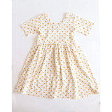 White short sleeve Lemon Shake Up All Day Twirl Dress with tiny orange flowers
