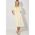 Woman in Lemon Meadow Gingham Midi Dress wearing a yellow gingham midi dress