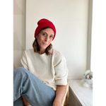 Person rocking a Lexi Beanie Hat, white sweater, and blue jeans for winter style