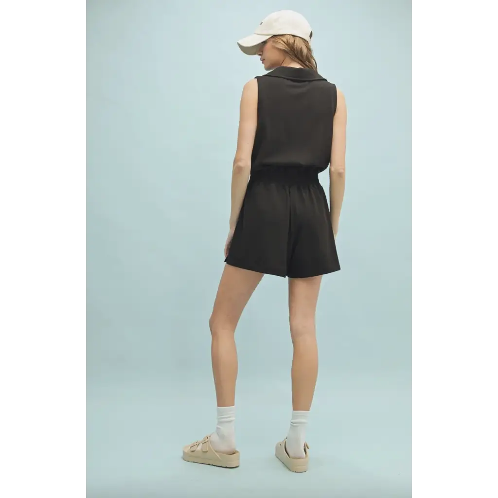 Black sleeveless romper with elastic waist in polished prints from Lexie Athletic Romper