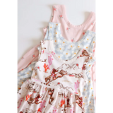 Three sleeveless Libby Twirl Dresses in pink and white floral patterns for fun days out