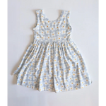 Light blue Libby Twirl Dress with a cute daisy floral print for fun adventures