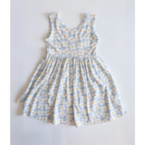 Light blue Libby Twirl Dress with a cute daisy floral print for fun adventures