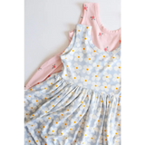 Light blue floral Libby Twirl Dress with pink dress peeking behind it