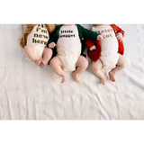 Three babies in Nugget Organic Cotton Onesies with cute text, perfect for 3mo fits closer