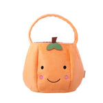 Soft orange pumpkin bucket bag with friendly face and green leaf detail perfect for Halloween trick-or-treating