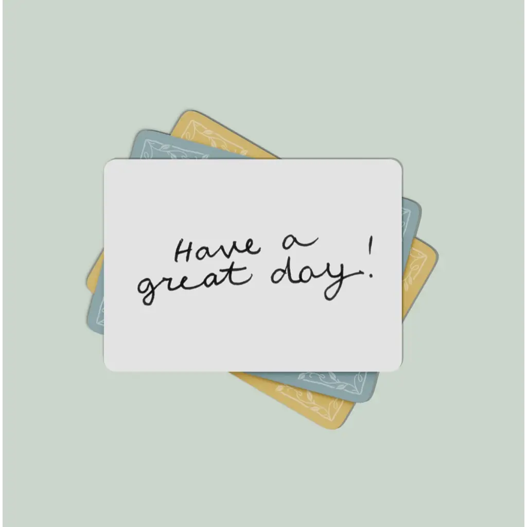 Handwritten lunch box note saying Have a great day on a card with colorful backgrounds