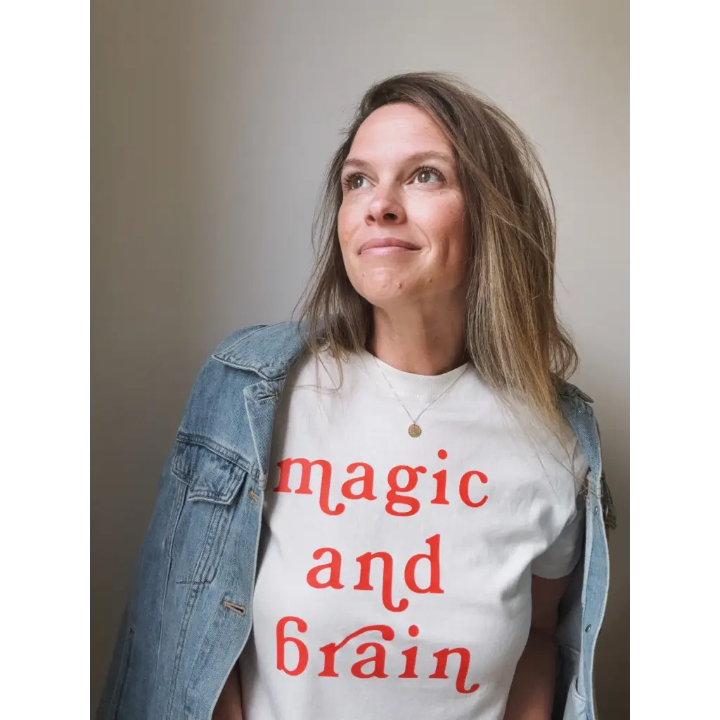 Woman wearing Magic & Brain Kate Baer T-Shirt with denim jacket, moon song vibe, final sale