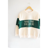 Cream sweatshirt with green stripe saying MAKE TIME FOR LEISURE, perfect for relaxing vibes
