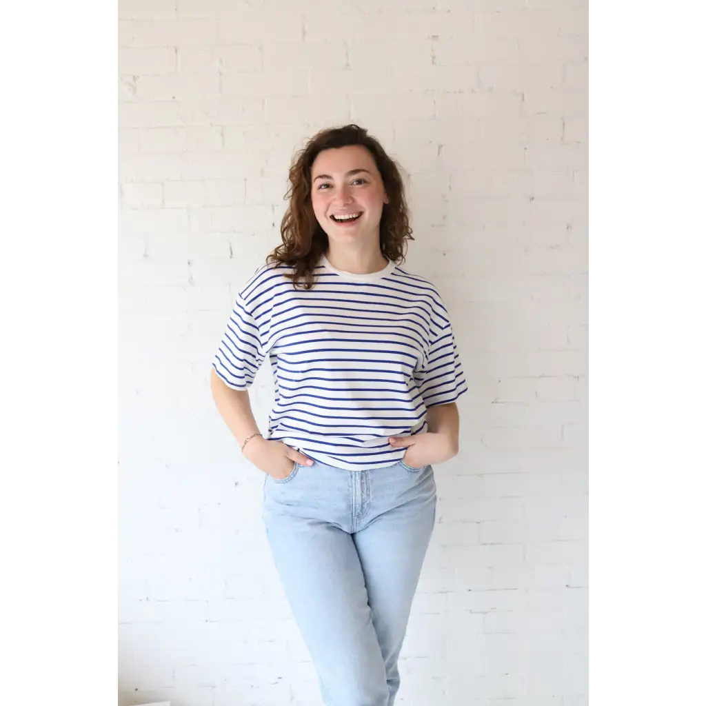 Smiling woman in Mary Striped Short Sleeve shirt featuring polished prints and stylish womens clothes