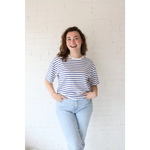 Smiling woman in Mary Striped Short Sleeve shirt featuring polished prints and stylish womens clothes