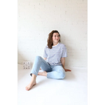 Woman in striped shirt and jeans showcasing Mary Striped Short Sleeve, perfect for stylish womens clothes and moms