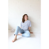 Woman in striped shirt and jeans showcasing Mary Striped Short Sleeve, perfect for stylish womens clothes and moms