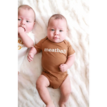 Two babies on white fabric, one in a Meatball Organic Cotton Baby Onesie