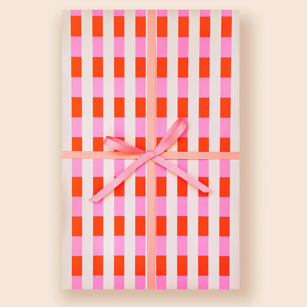 Gingham-patterned notebook with pink ribbon from Muchachi Merengue Modern Wrapping Paper