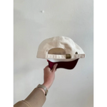 Two-toned unisex rope hat with a cream crown and burgundy brim for style and comfort