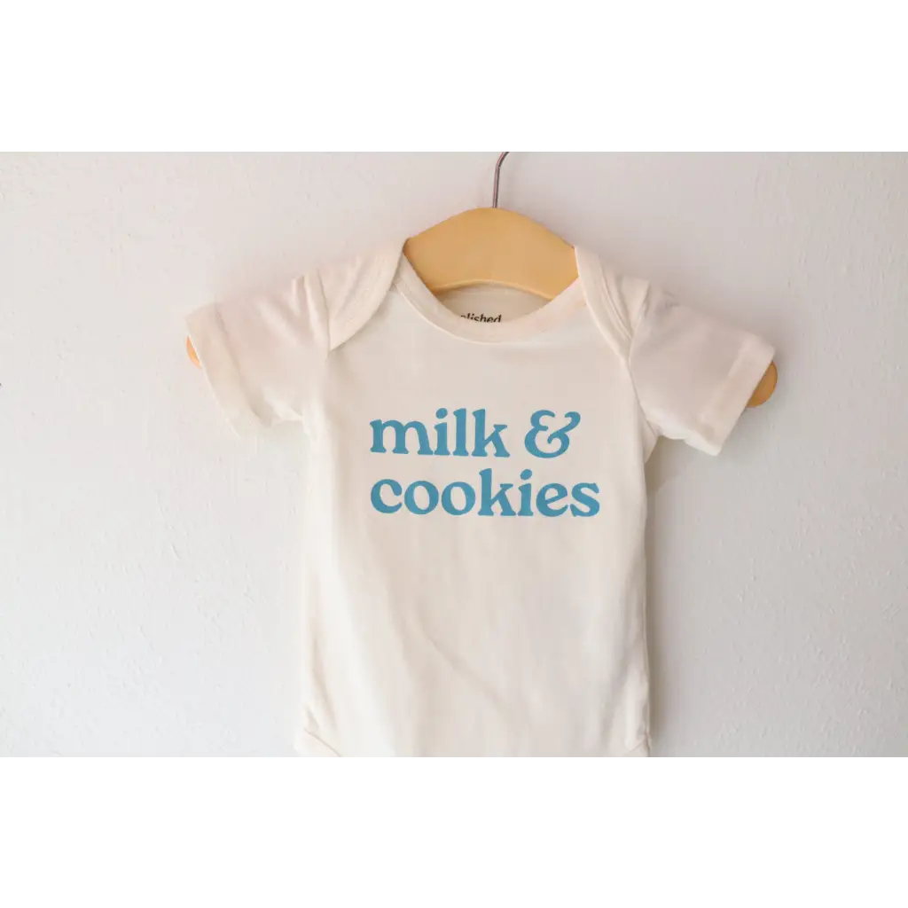 White gender neutral onesie in organic cotton with blue milk and cookies print