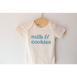 White gender neutral onesie in organic cotton with blue milk and cookies print