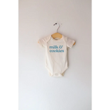 Cream-colored gender neutral onesie in organic cotton with milk and cookies design