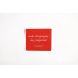 Playful sticker featuring red coaster that says more champagne less judgement for fun vibes