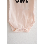 Light pink organic cotton night owl onesie for baby with OWL text at the top