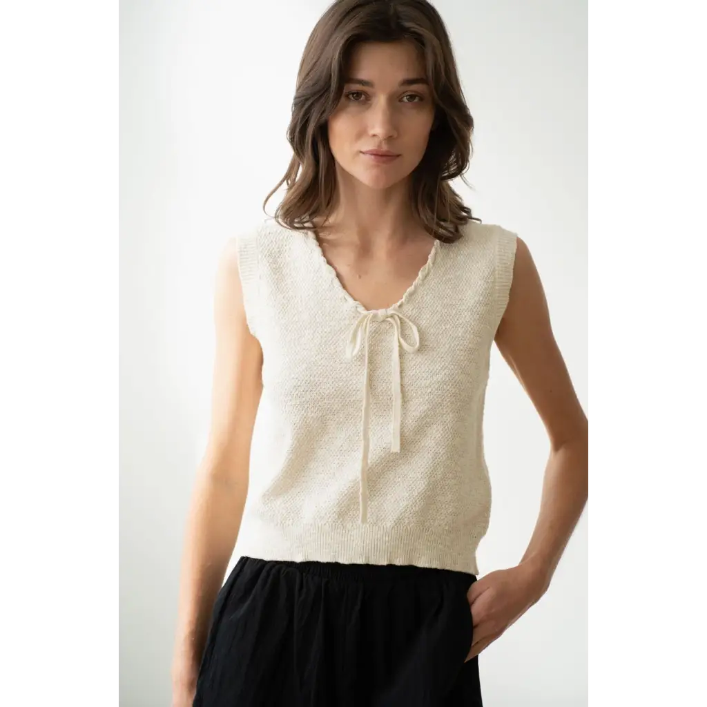 Woman in cream knit vest from Olivia V-Neck Knit Vest with Neck Strap, stylish womens clothes