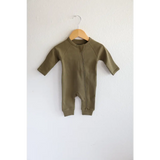 Olive green cotton baby zipper romper on wooden hanger for organic cotton kidswear