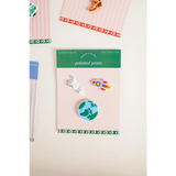 Fun 3-piece outer space charm set with rocket, planet, and unicorn enamel pins