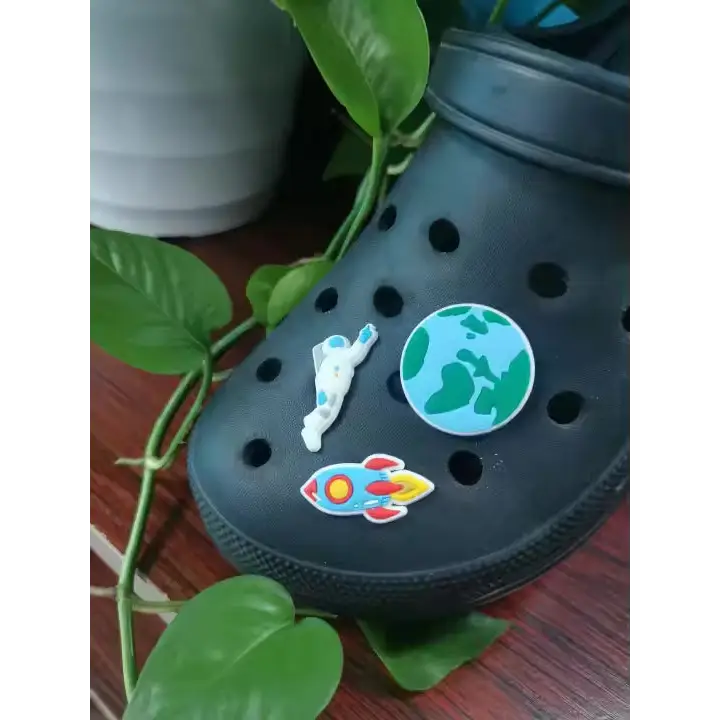 Black Croc shoe with 3-piece outer space charm set featuring astronaut, Earth, and rocket