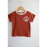 Rust Peace Embroidered Ringer Tee for Kids featuring a white peace symbol design