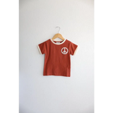 Rust Peace Embroidered Ringer Tee for Kids on hanger, a stylish everyday ringer option