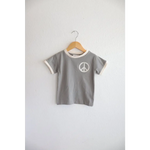 Gray Everyday Ringer Tee with White Peace Symbol Design on Wooden Hanger