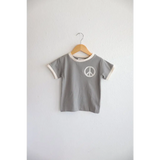 Gray Everyday Ringer Tee with White Peace Symbol Design on Wooden Hanger
