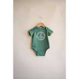 Green baby onesie with peace symbol design from the Peace Floral Organic Cotton collection