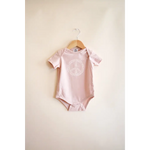 Pink Peace Floral Organic Cotton Baby Onesie with cute panda design on hanger