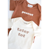 Two baby onesies in organic cotton, brown Peanut and white Tater Tot for 3mo fits