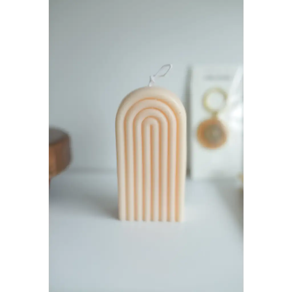 Peach-colored ribbed Petite Rainbow Candle for a fun and colorful home vibe