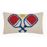 Decorative throw pillow showcases two crossed pickleball paddles in red and blue