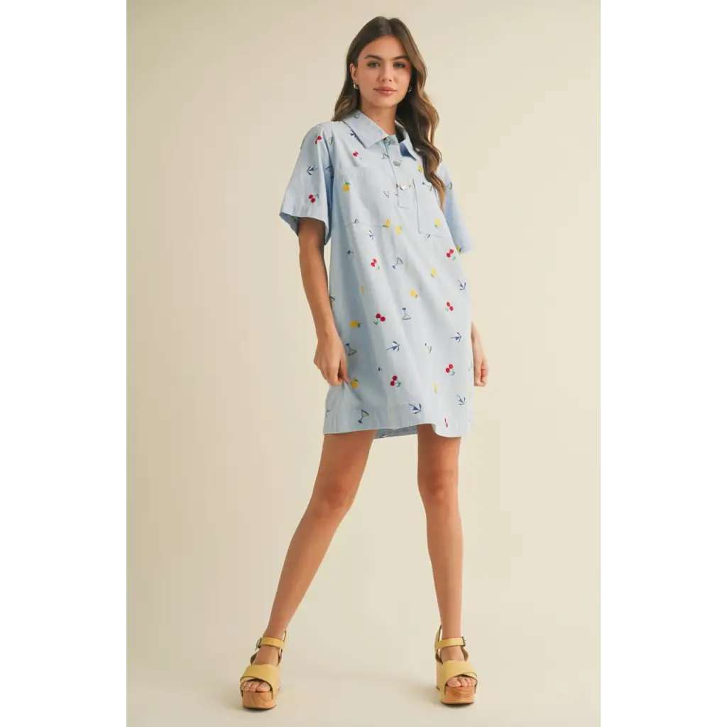 Light blue collared mini dress with colorful cherry embroidery, perfect for summer picnics