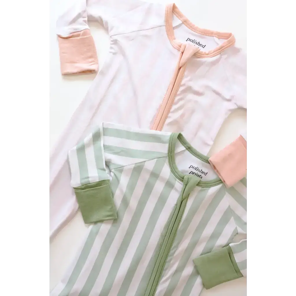 Two pink striped bamboo baby sleepers for comfy and cozy baby sleep time