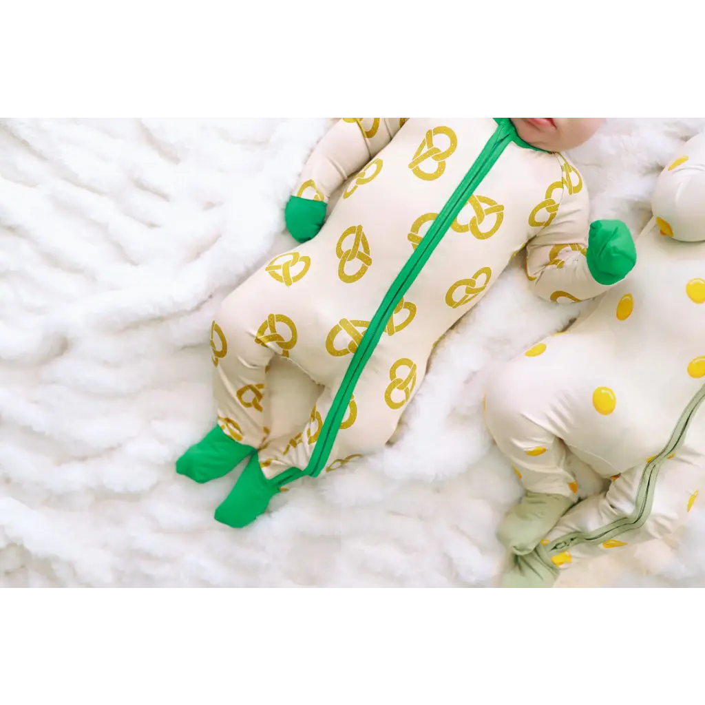Baby sleeper with fun pretzel and polka dots in white, green, and yellow for comfy nights