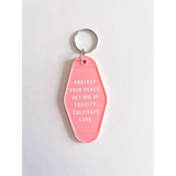 Cute Pink acrylic retro motel keychain with peace and love vibes to protect your peace