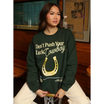 Green sweatshirt with horseshoe design, perfect stylish women’s clothes for moms