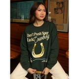 Green sweatshirt with horseshoe design, perfect stylish women’s clothes for moms