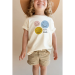 Child’s smiley faces T-shirt with random acts of kindness logo and fade-resistant inks