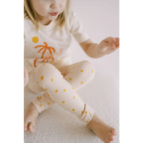 White pajama set featuring orange palm trees and yellow polka dots for Shine Bright Star leggings