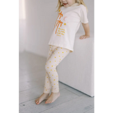 White pajama set with yellow polka dot pants and t-shirt for Shine Bright Star kids leggings
