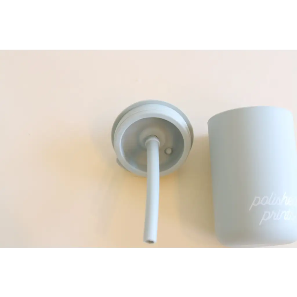 White plastic toilet brush with holder beside Pastel Mini Silicone Straw Cups for Kids